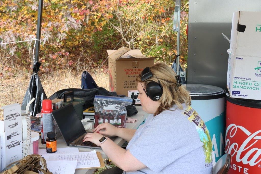 Volunteer working at a laptop during the event